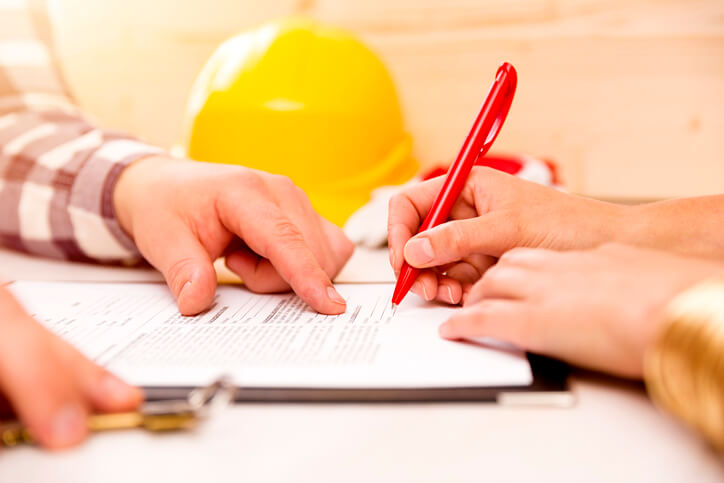 Construction lawyer signing papers